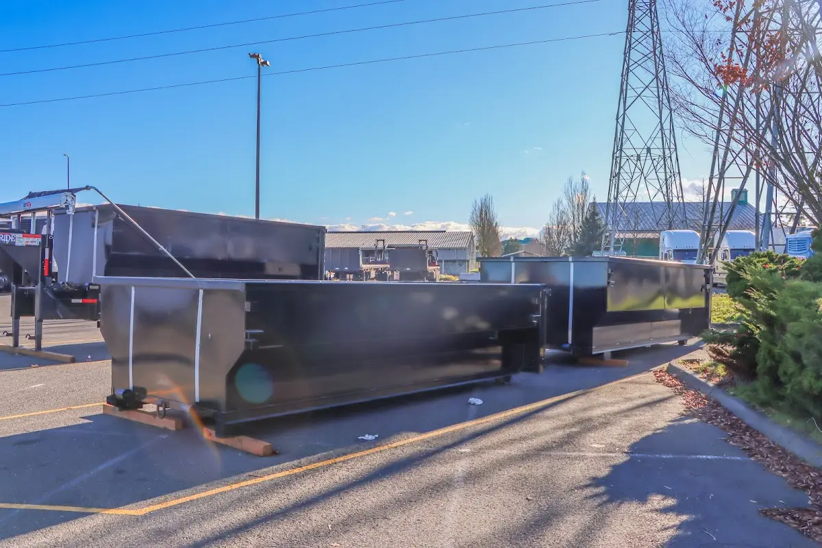 Roll-off dumpster ready for waste disposal at job site for Construction Dumpster Rental in Douglass